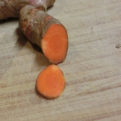 Turmeric root on a board